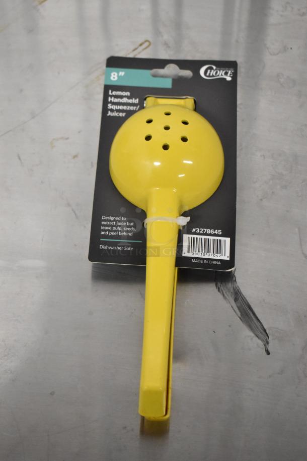 Choice 8" yellow handheld aluminum lemon juicer, brand new, #3278645 on label, designed to extract juice, dishwasher safe.