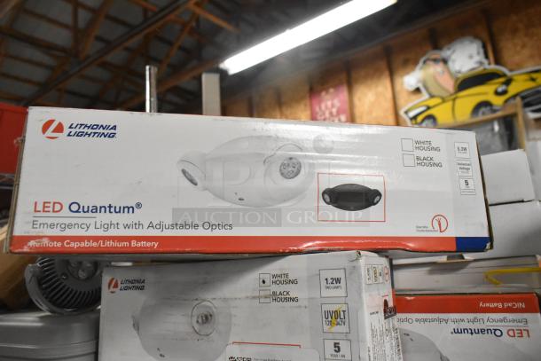 Lithonia Lighting LED Quantum emergency lights with adjustable optics in original packaging. Includes white and black housing options, remote capable with lithium battery.