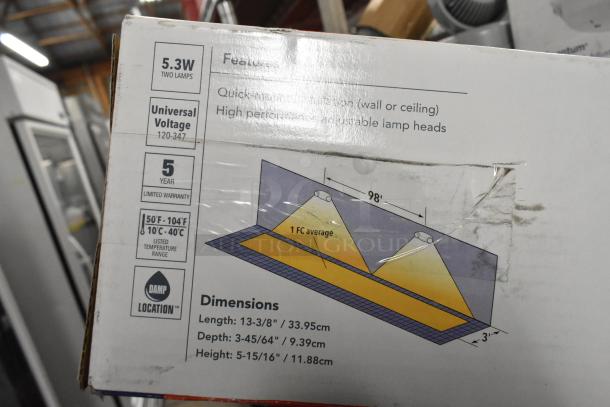 Box of Lithonia Lighting emergency lights, exit signs. Features 5.3W two lamps, universal voltage, 5-year warranty.