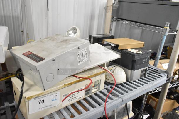 6 assorted items including Altronix BH12DC8CB box, emergency light, and Schneider box on a metal shelf. Various cables visible.