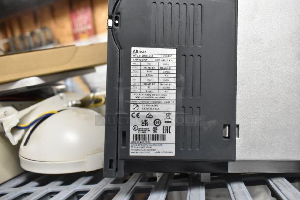 6 various items including Altronix BH12DC8CB box, emergency light, and Schneider box. Visible: Altivar label, CE markings.