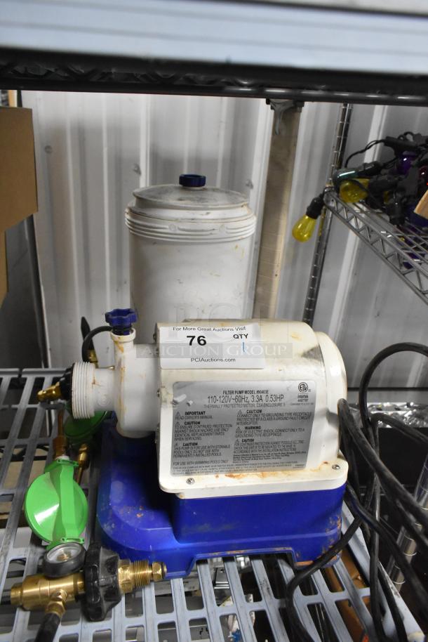 90403E Filter Pump, 110-120V 1 Phase. Visible wear, blue and white casing, with label displaying specifications.