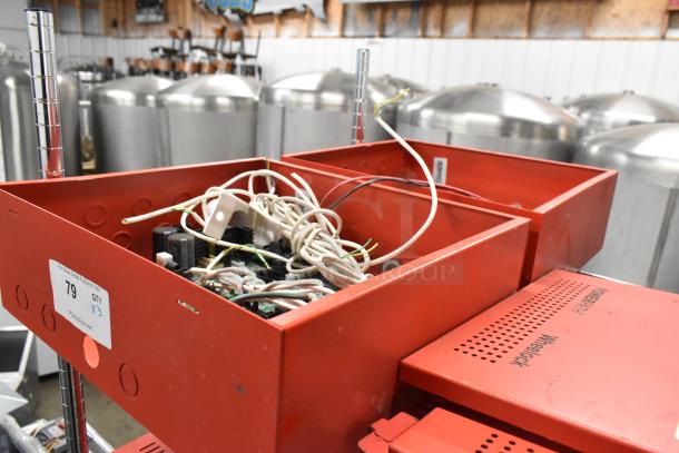 Three Wheelock PS-8 Powerpath NAC Extenders, open red enclosures showing wiring and components, labeled with item number 79.