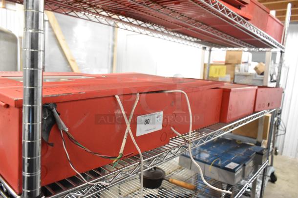5 red Wheelock SP40S Safepath voice evacuation panels on metal shelving. Visible wires, minor wear. Label reads "QTY x5".