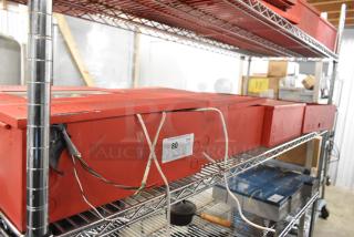 5 red Wheelock SP40S Safepath voice evacuation panels on metal shelving. Visible wires, minor wear. Label reads "QTY x5".