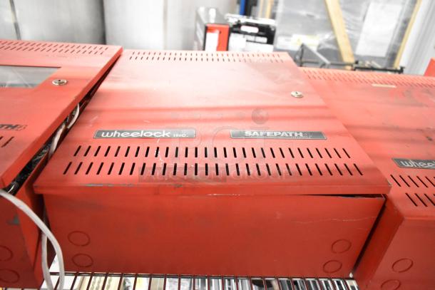 Wheelock SP40S Safepath Multi Fac Com Sys, visible scratches, red casing, label indicating 40-watt voice evacuation panel.