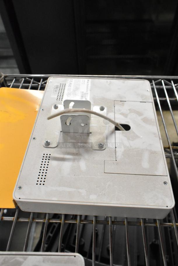 Wren Solutions panel, off-white, mounted on metal rack; visible wear, labels indicate compliance and specifications.