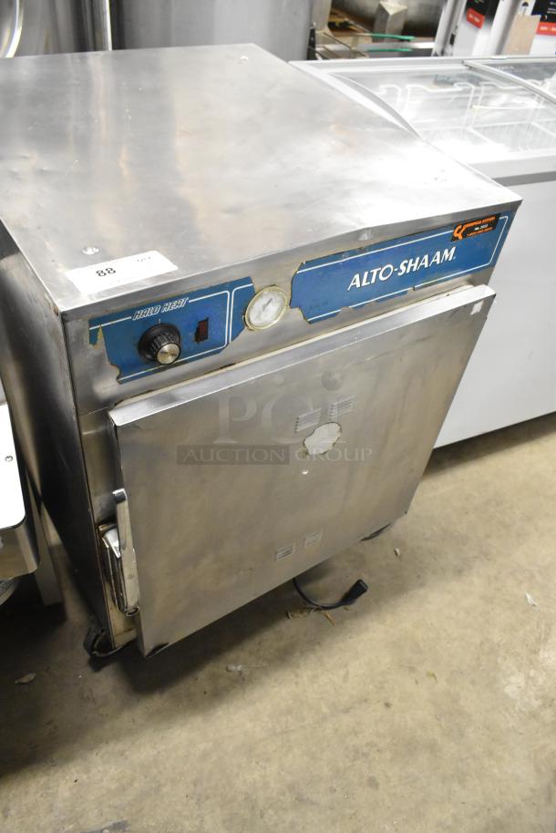 Alto Shaam 750-S stainless steel heated holding cabinet on casters, 125V, 1 phase. Visible wear, gauge and control knob present.