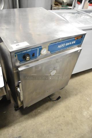 Alto Shaam 750-S stainless steel heated holding cabinet on casters, 125V, 1 phase. Visible wear, gauge and control knob present.