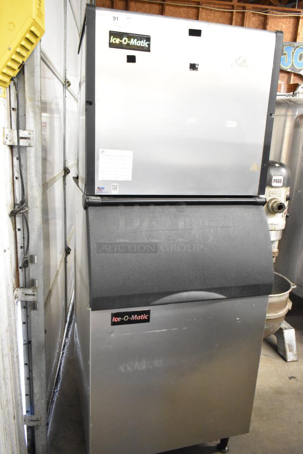 Ice-O-Matic ICE1006HW7 commercial ice machine with bin, stainless steel, 208-230V, 1 phase, in good condition.