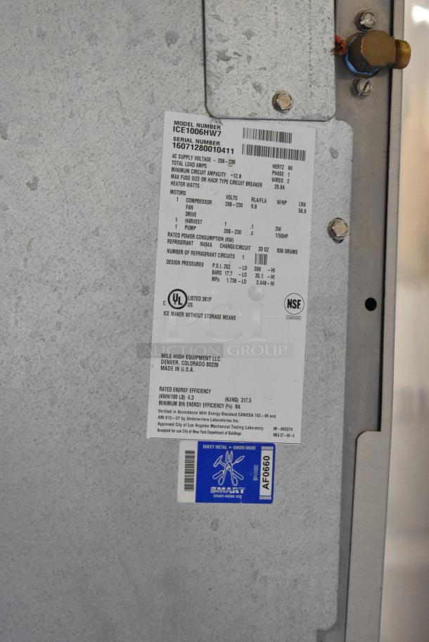 Ice-O-Matic ICE1006HW7 stainless steel commercial ice machine head. Features 208-230 volts, 1 phase. UL and NSF certified tags visible.
