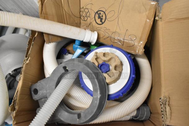 Bestway 58498E Sand Filter System in cardboard box, with hoses and components visible. 110-120 Volts, 1 Phase.