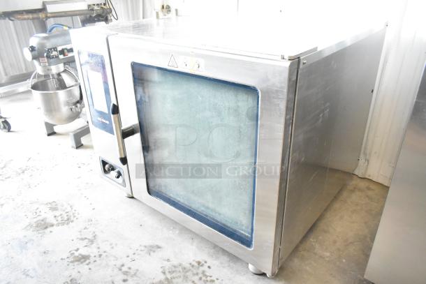 2021 Alto Shaam CTP7-20E stainless steel commercial combi convection oven with glass damage, 208-240V, 3 phase.