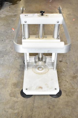 Countertop pineapple corer with stainless steel coring blade, sturdy metal frame, used condition. Marked with auction info.