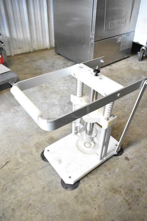 Countertop Pineapple Corer in good condition, featuring a sturdy metal frame and ergonomic handle for easy coring.