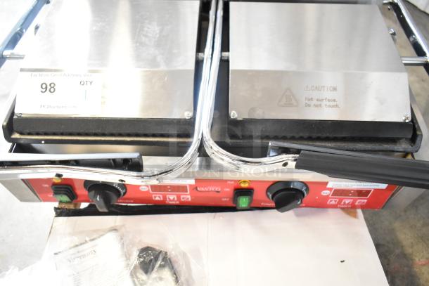 Brand new Avantco 177PG400GST stainless steel panini grill with timer. Grooved top, smooth bottom, 19 5/8" x 9 1/8" surface.