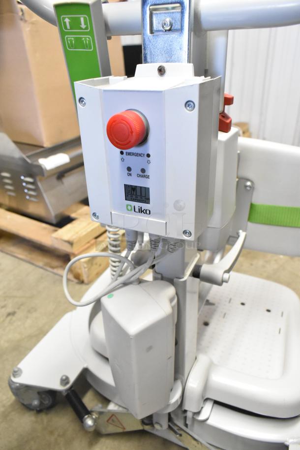 Sabina II Sit To Stand Patient Lift by Liko, featuring emergency stop button and charging indicator. Excellent condition.