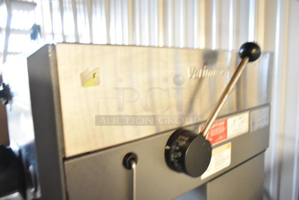 Varimixer W20 commercial mixer on stand, metal finish, includes whisk and pastry attachments, 115V, visible control labels.