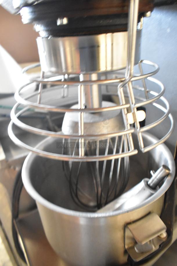 Varimixer W20 metal 20-quart planetary dough mixer with bowl, whisk, pastry attachments, and bowl guard on stand.