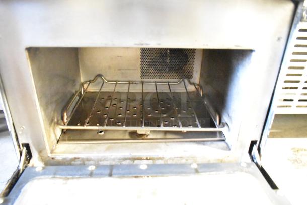 Turbochef NGO commercial rapid cook oven, metal interior, electric, 208/240V, 1 phase, open door view showing rack.