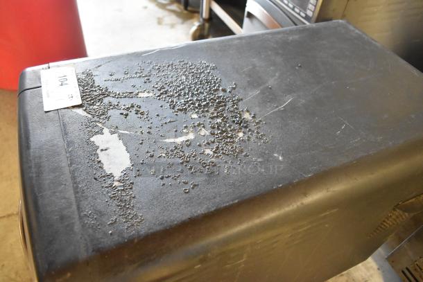 Turbochef NGO rapid cook oven, countertop model, showing top surface wear. Electric, 208/240V, 1 Phase. Tag labeled "104".