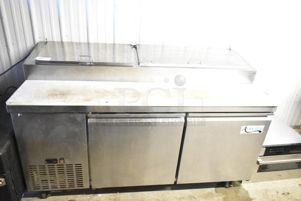 Avantco 178PICL2 stainless steel commercial pizza prep table on casters. Features dual doors, stainless surface, 115V, 1-phase.