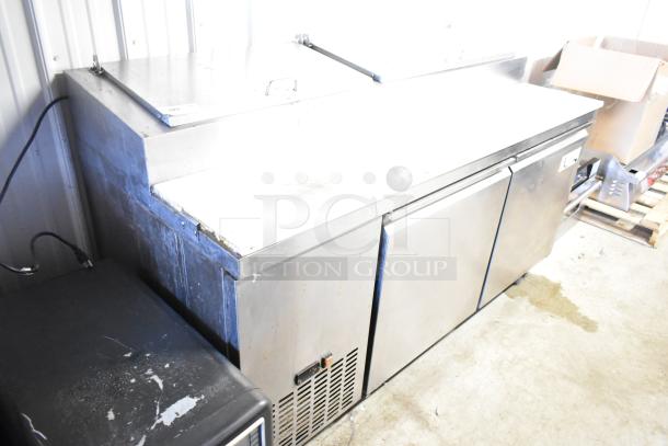 Avantco 178PICL2 stainless steel commercial pizza prep table on casters, 115 volts, excellent condition, with storage compartments.