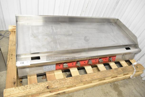 Avantco 177EG60E stainless steel commercial electric griddle, flat top, 240V, 1 phase, on pallet, visible wear.