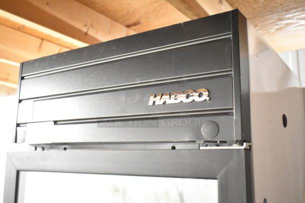 2019 Habco SE18 metal commercial single door reach-in cooler, features poly-coated racks, 115V, 1 phase.