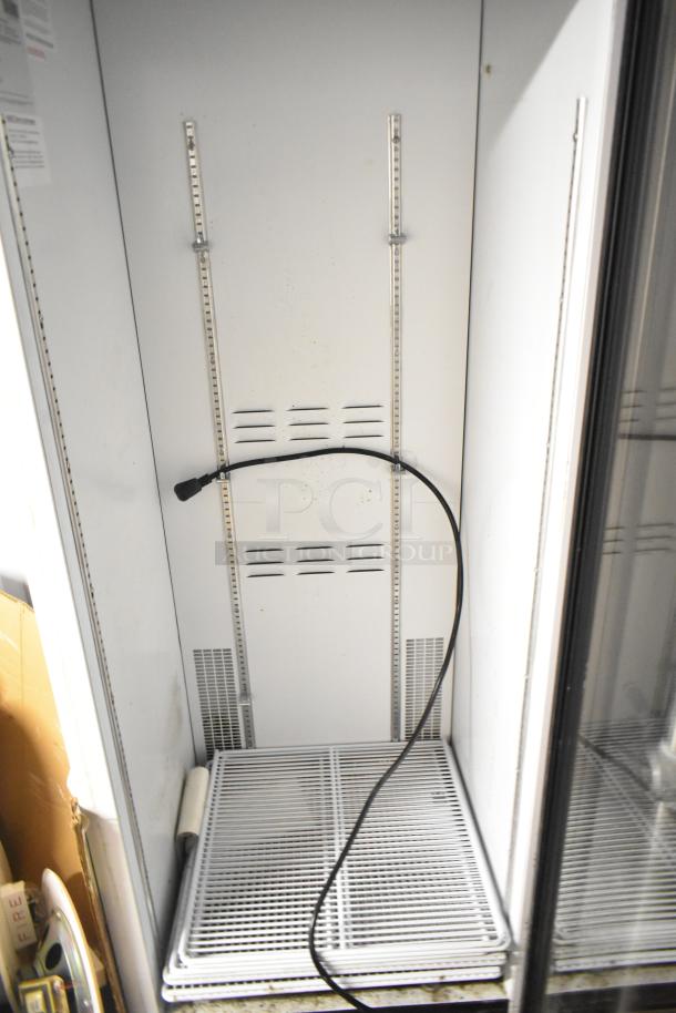 2019 Habco SE18 commercial cooler, single door, poly-coated racks, 115V, 1 phase. Clean interior, visible power cord.