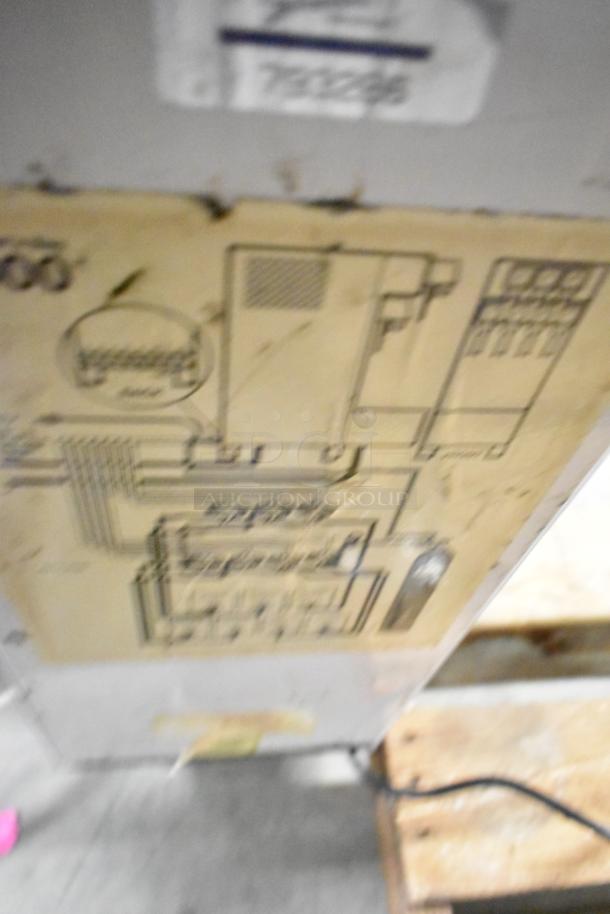 Metal commercial 3-flavor slushie machine, countertop model. Requires 115 volts, 1 phase. Tags show wiring diagram.