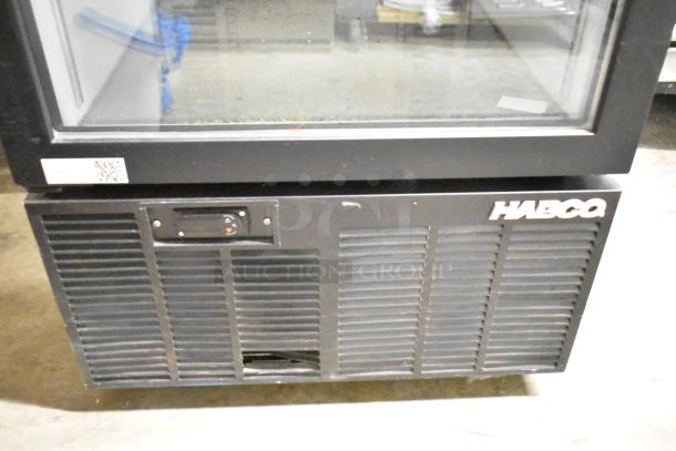 Habco SE12 metal commercial reach-in cooler, single door, poly coated racks, 115V, 1 phase. Visible minor wear.