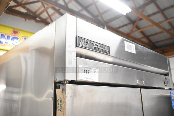 2016 True T-35 stainless steel commercial 2-door cooler with poly-coated racks. Features commercial casters. Model T-35.