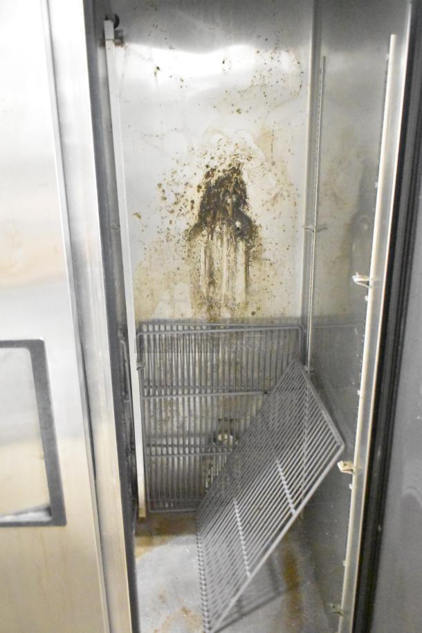 2016 True T-35 stainless steel commercial cooler, interior shows wear with stains, includes poly coated racks, on casters, 115V.