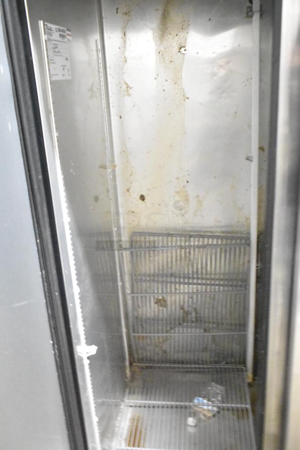 2016 True T-35 stainless steel 2-door reach-in cooler, poly-coated racks, commercial casters, shows signs of wear.