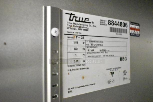 2016 True T-35 stainless steel commercial cooler label showing model and voltage details.