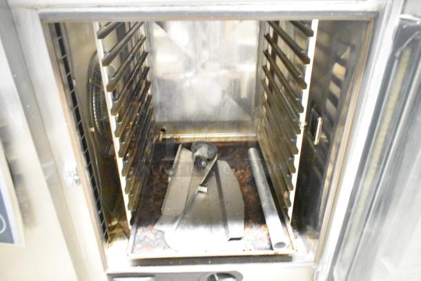 Rational SCCWE62/SCCWE102 stainless steel convection oven interior. Features racks and accessories, commercial use.