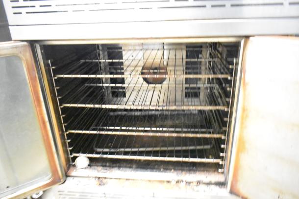 2 Imperial stainless steel full-size convection ovens with solid doors, view-through features, metal racks, and thermostatic controls.