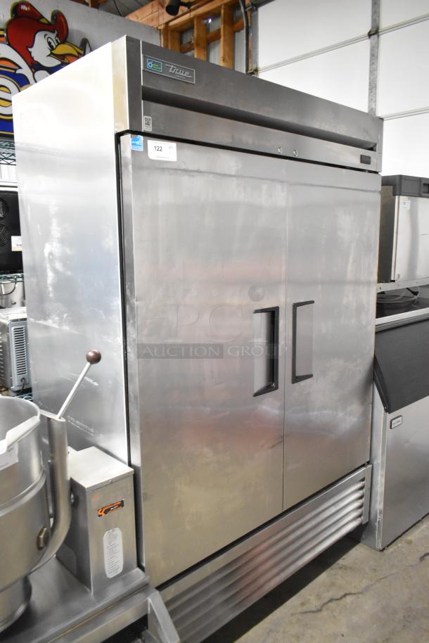 2020 True T-49F-HC stainless steel 2-door commercial freezer with poly racks and casters, 115 volts, good condition.