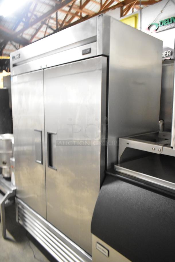 2020 True T-49F-HC stainless steel commercial 2-door freezer with poly-coated racks, on casters. 115V, 1 phase.