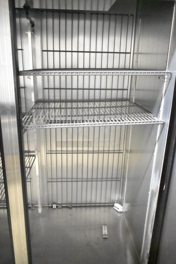 2020 True T-49F-HC stainless steel commercial 2-door reach-in freezer, poly-coated racks, on casters, 115V, 1 phase.