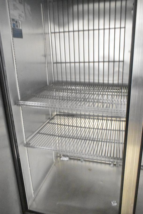 2020 True T-49F-HC stainless steel 2-door freezer, poly coated racks, commercial casters, 115V, excellent condition.