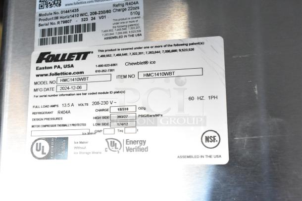 2024 Follett HMC1410WBT ice machine tag on stainless steel surface, showing model, voltage, and certification details.