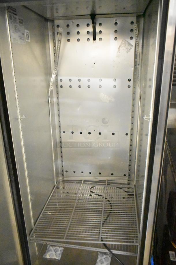 2018 True T-23F-HC stainless steel single door commercial freezer with poly coated racks, commercial casters, 115V, excellent condition.