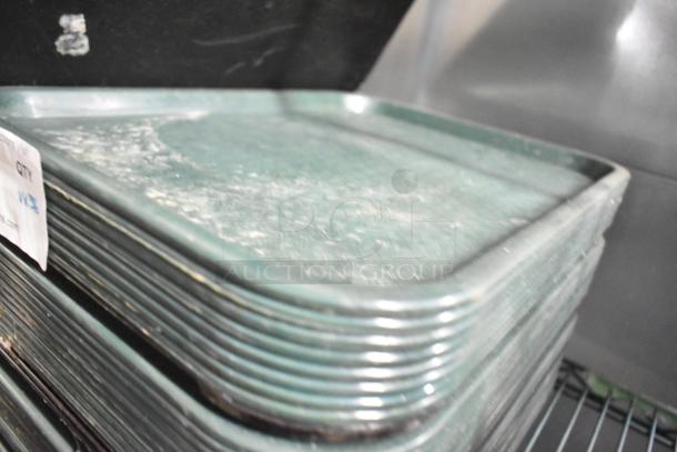 Stack of 36 green poly food trays, good condition, includes inventory label indicating quantity.