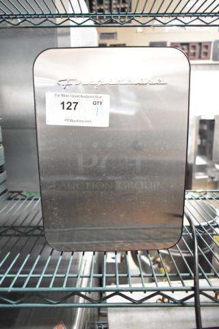 2023 Frigidaire Stainless Steel Mini Cooler, 10L 0.35 cu. ft., 120V, DC 12V, like new with original markings.