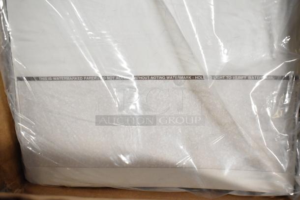 Transparent bag containing watermarked paper with text "THIS IS WATERMARKED PAPER - DO NOT ACCEPT WITHOUT NOTING WATERMARK."