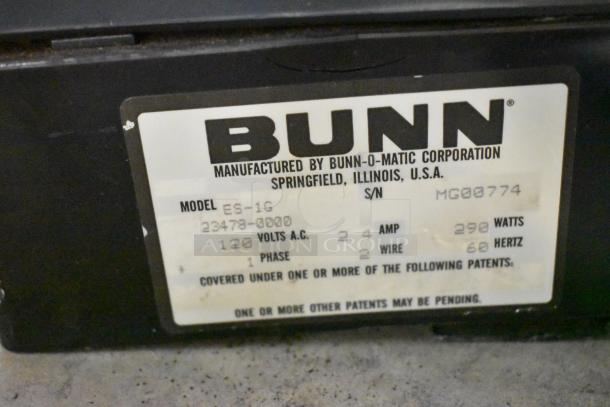 Bunn ES-1G Metal Commercial Espresso Grinder. 120V, 1 Phase. Label shows model and voltage details; made in USA.