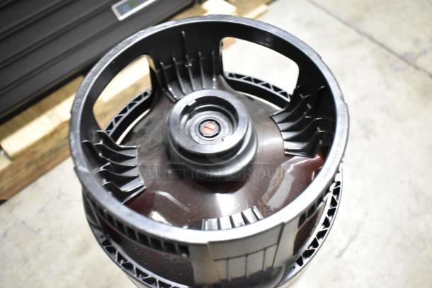 Plastic beer keg with built-in handles, circular opening, and visible markings. Appears to be in good condition.