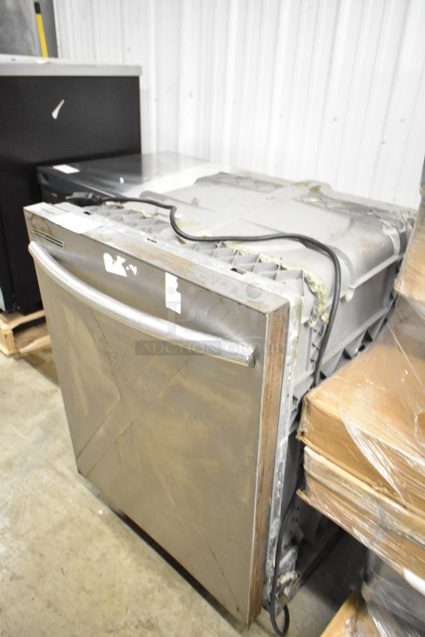 Samsung DW80M2020US stainless steel dishwasher. Used condition with visible wear. Undercounter model, 120V, 1 phase.